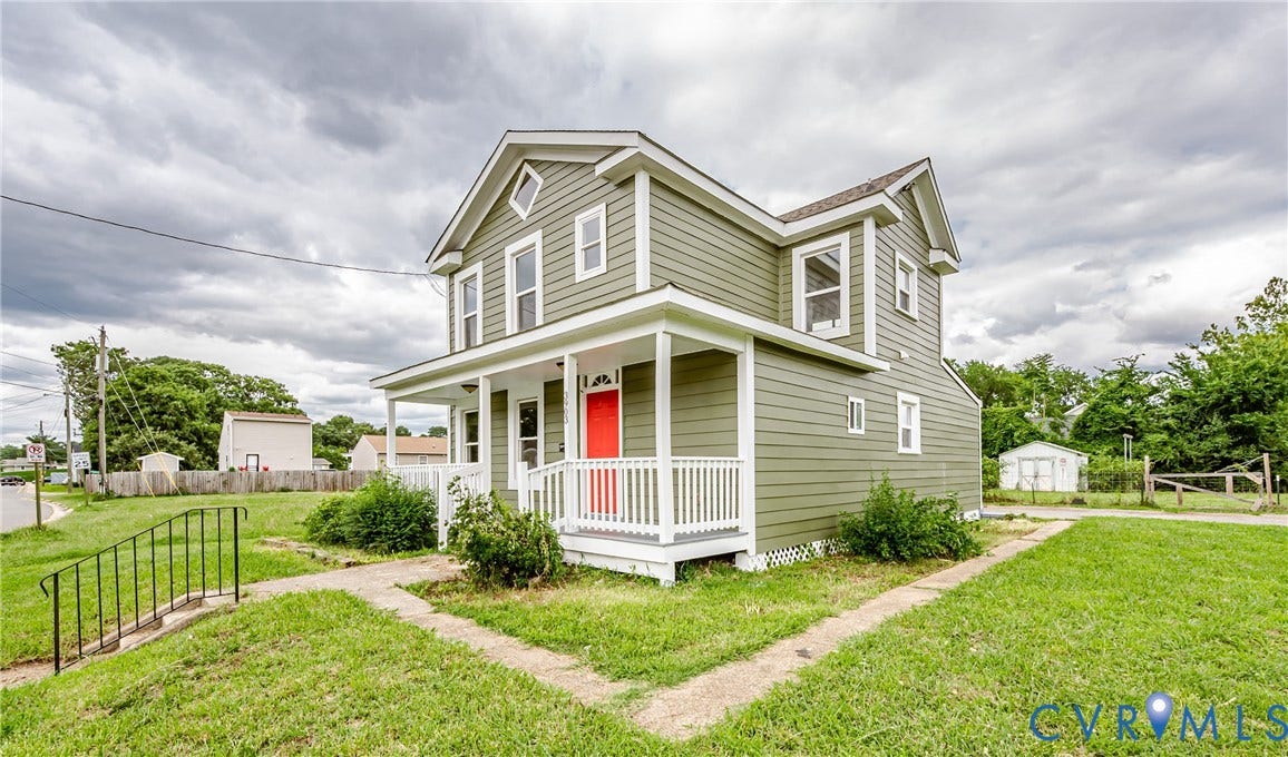 3903 Delmont Street, Henrico, VA 23222 Two-story residence featuring green siding, a covered front porch with white railings, and an accent red entry door