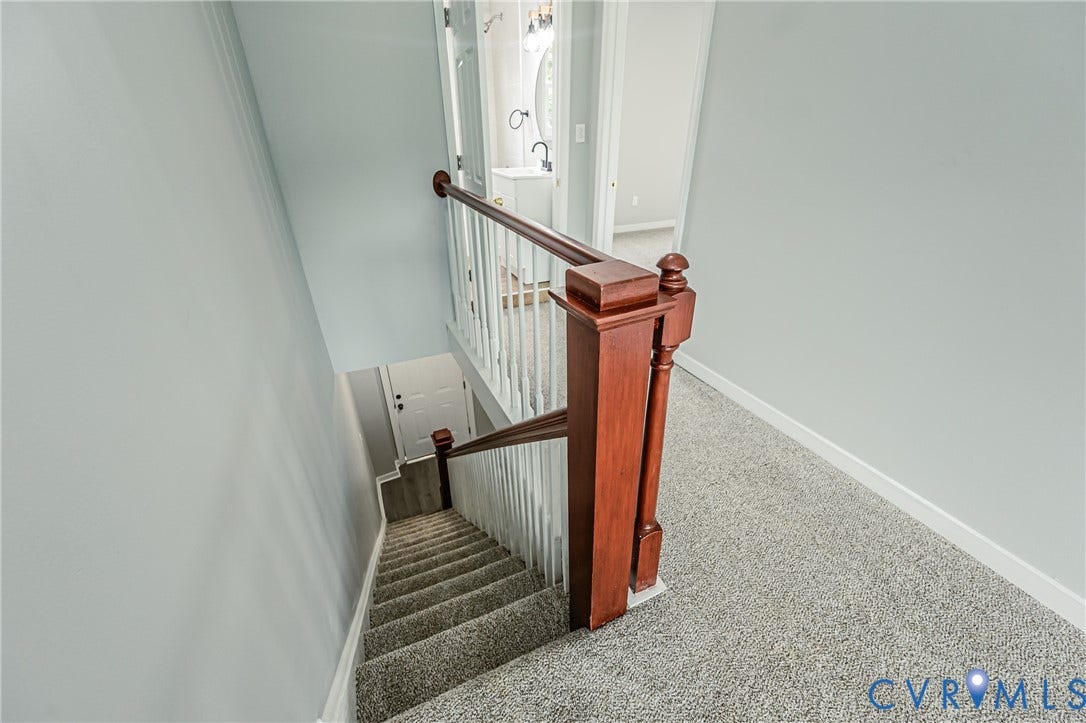 3903 Delmont Street, Henrico, VA 23222 Carpeted staircase with dark wood-finish newel post and white balusters