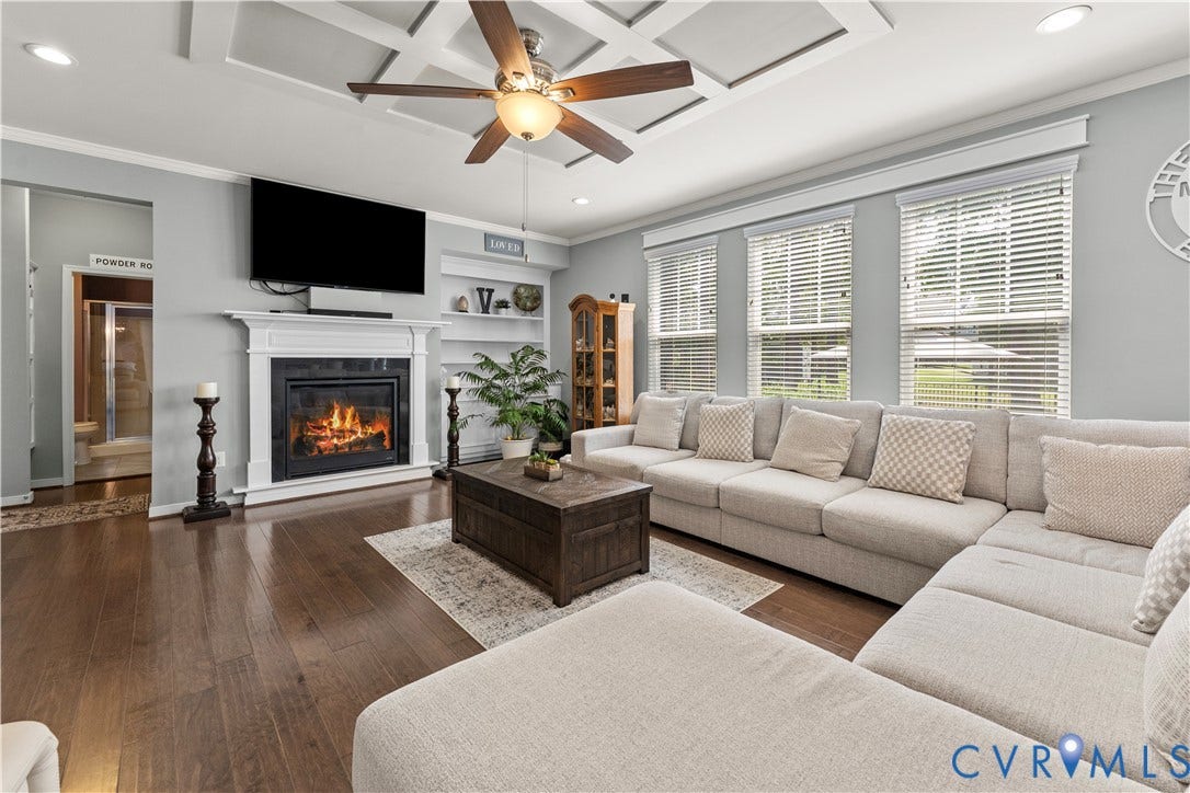 8800 Glen Royal Drive, Chesterfield, VA 23832 Living area featuring rich wood-finish flooring, a coffered ceiling, and a fireplace with a white mantel