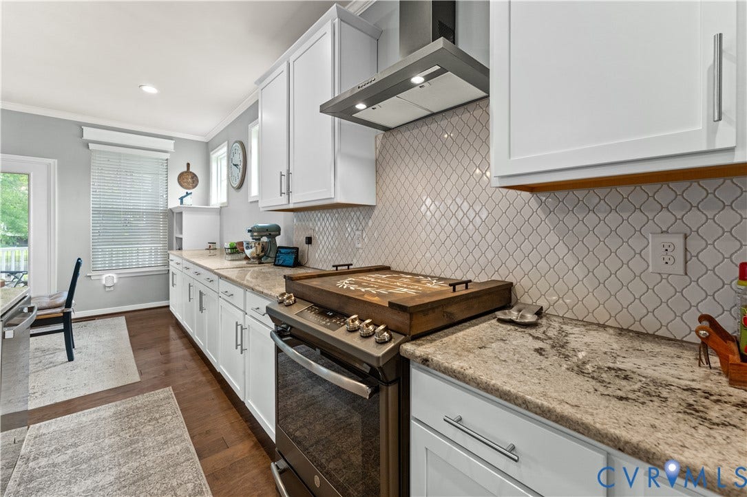 8800 Glen Royal Drive, Chesterfield, VA 23832 Kitchen featuring white cabinetry, stone countertops, a stainless steel range with overhead hood, arabesque tile backsplash, and wood-finish flooring