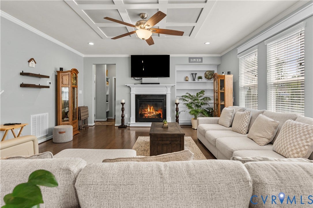 8800 Glen Royal Drive, Chesterfield, VA 23832 Living area featuring coffered ceiling with a ceiling fan, hardwood flooring, and a fireplace with a white mantel