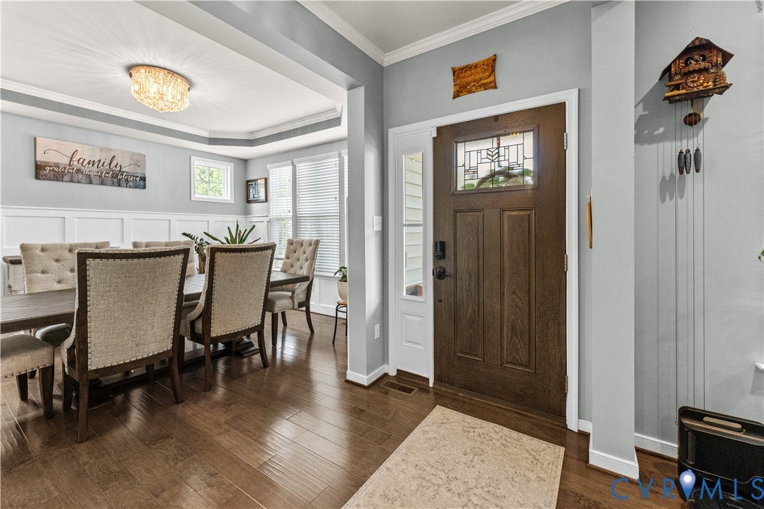 8800 Glen Royal Drive, Chesterfield, VA 23832 Entryway featuring a rich wood-finish door with decorative glass inlay, sidelight, and polished wood-finish flooring