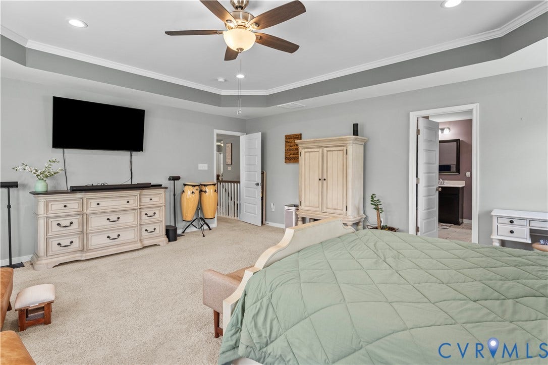 8800 Glen Royal Drive, Chesterfield, VA 23832 Spacious interior room featuring a tray ceiling with crown molding, recessed lighting, and a ceiling fan