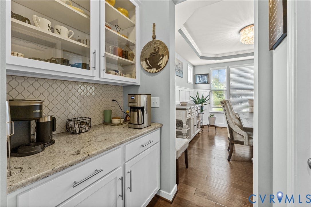 8800 Glen Royal Drive, Chesterfield, VA 23832 Kitchenette featuring white cabinetry, glass-front upper cabinets, and a patterned tile backsplash