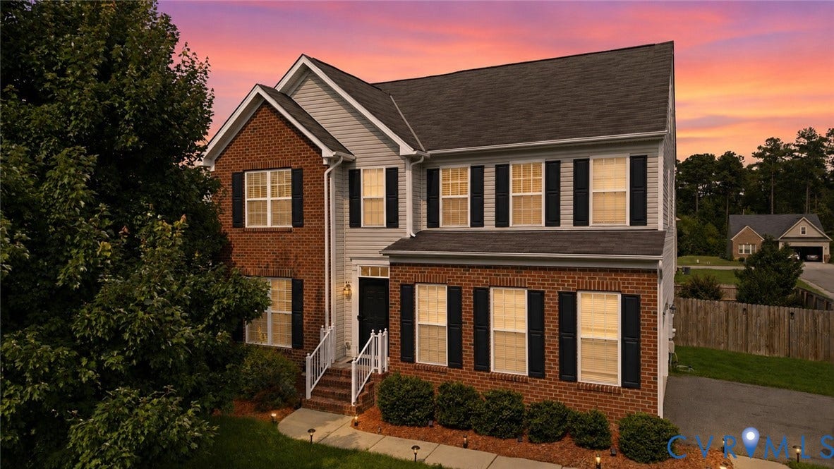 5713 Kings Grove Drive, Kings Grove, Chesterfield, VA 23832 Two-story residence featuring a brick and siding exterior, black shutters, and an asphalt shingle roof
