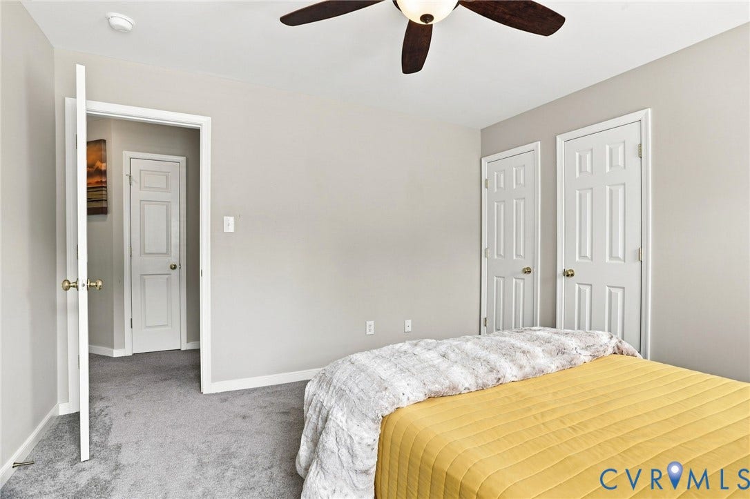 5713 Kings Grove Drive, Kings Grove, Chesterfield, VA 23832 Carpeted interior room featuring light gray walls, white trim, and a ceiling fan with integrated lighting