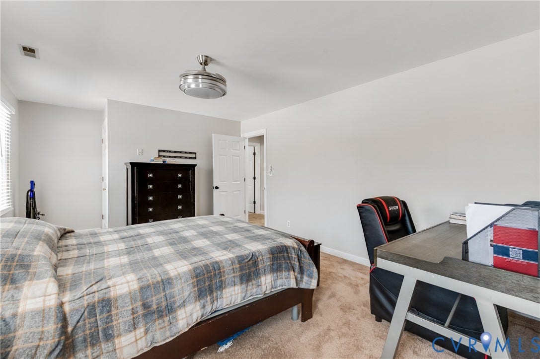 11611 Riverpark Way, Chesterfield, VA 23838 Spacious room with light neutral wall tones and plush carpeting