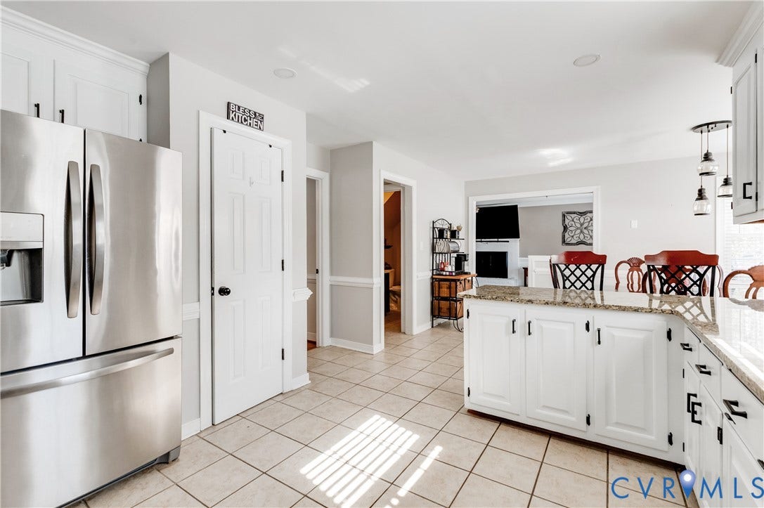 11611 Riverpark Way, Chesterfield, VA 23838 Spacious kitchen featuring white cabinetry, stone countertops, and tile flooring
