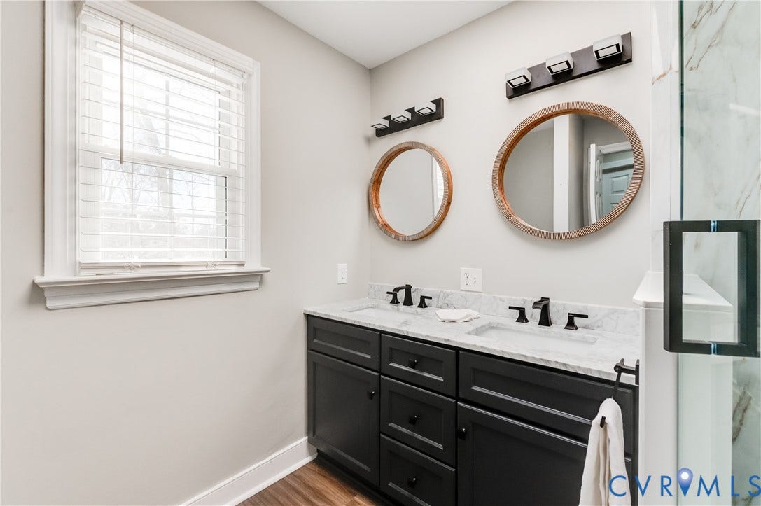 11611 Riverpark Way, Chesterfield, VA 23838 Double vanity featuring black cabinetry, white countertops, and matte black fixtures