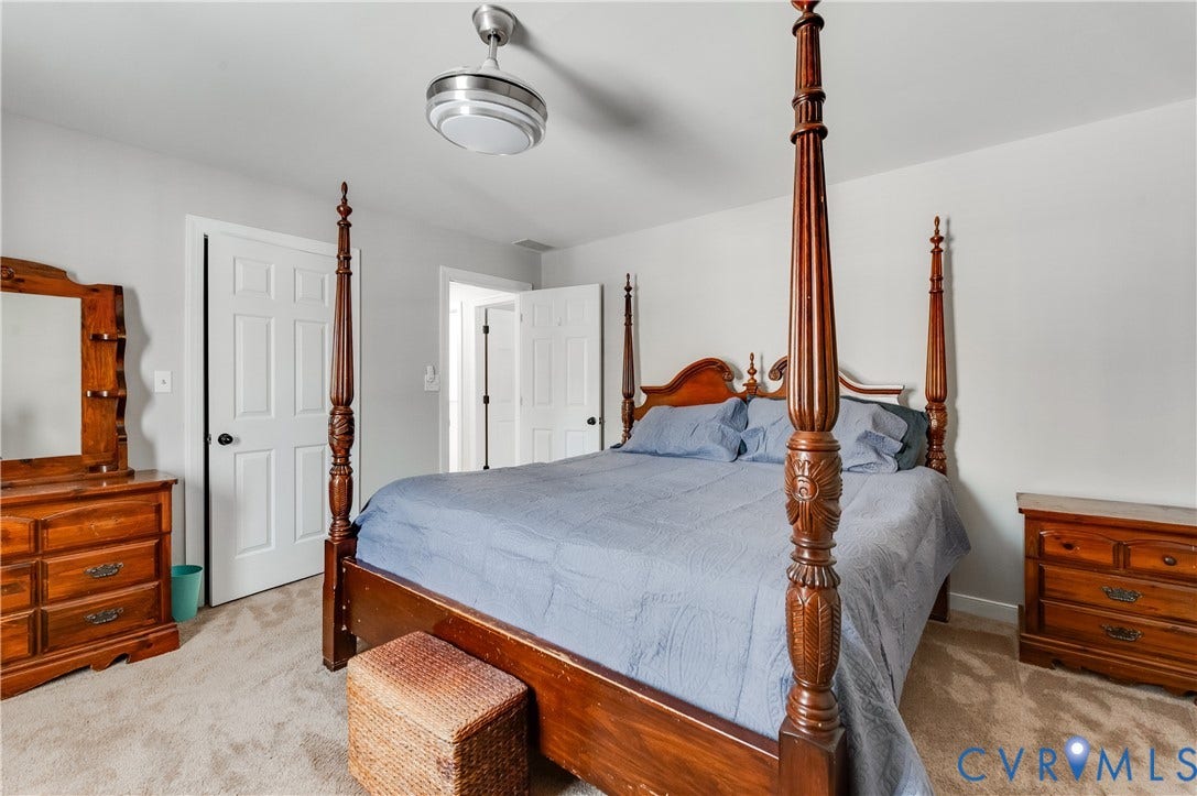 11611 Riverpark Way, Chesterfield, VA 23838 Carpeted bedroom featuring light gray walls, a ceiling fan with integrated lighting, and white paneled doors