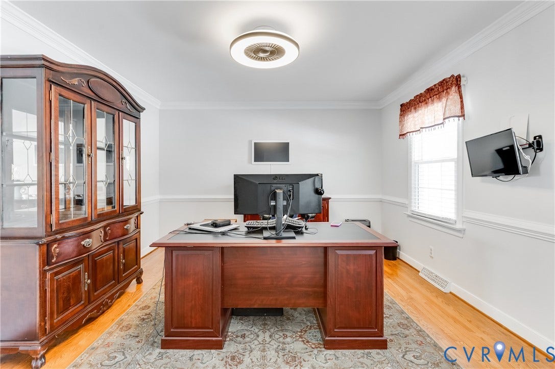 11611 Riverpark Way, Chesterfield, VA 23838 Light wood-finish flooring with a decorative area rug, white walls, and a single window with blinds