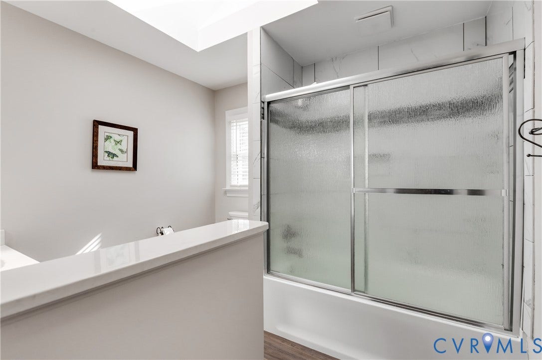 11611 Riverpark Way, Chesterfield, VA 23838 Bathtub with sliding frosted glass enclosure and full-height tile surround