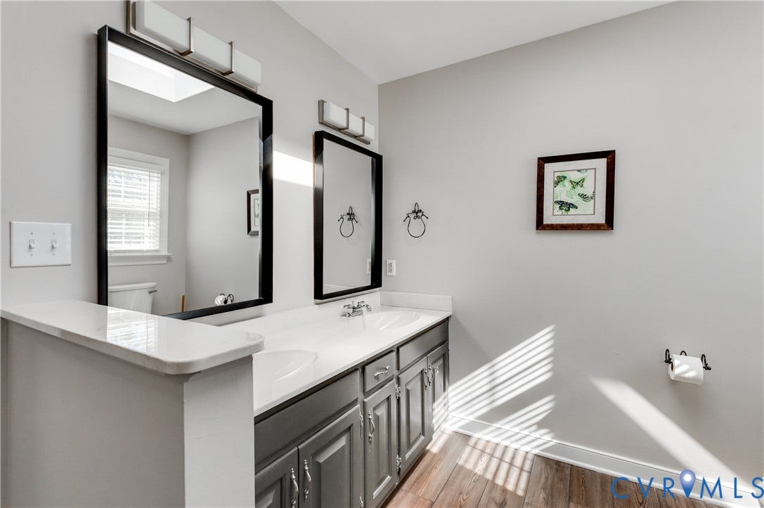 11611 Riverpark Way, Chesterfield, VA 23838 Dual vanity with white countertops, undermount sinks, and gray cabinetry