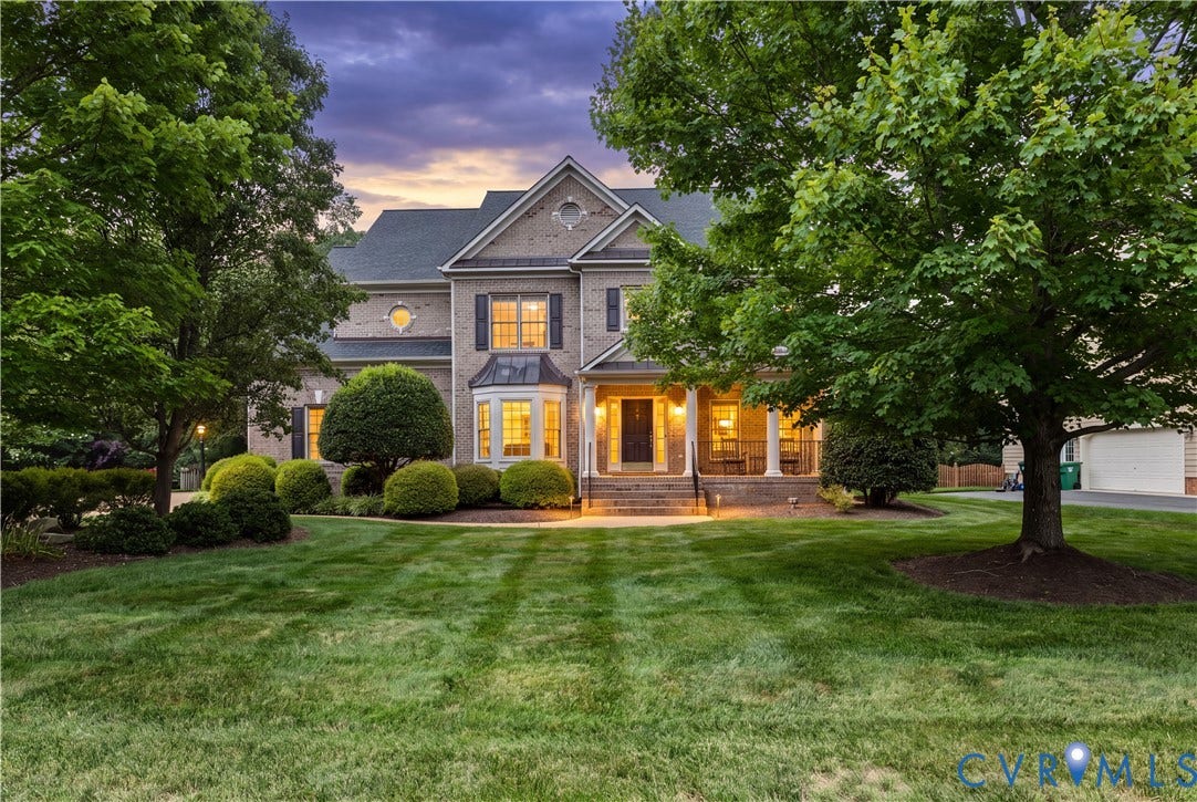 12112 Blairmont Court, Glen Allen, VA 23059 Multi-level brick exterior featuring a covered front porch, bay window, architectural roof shingles, and mature landscaping