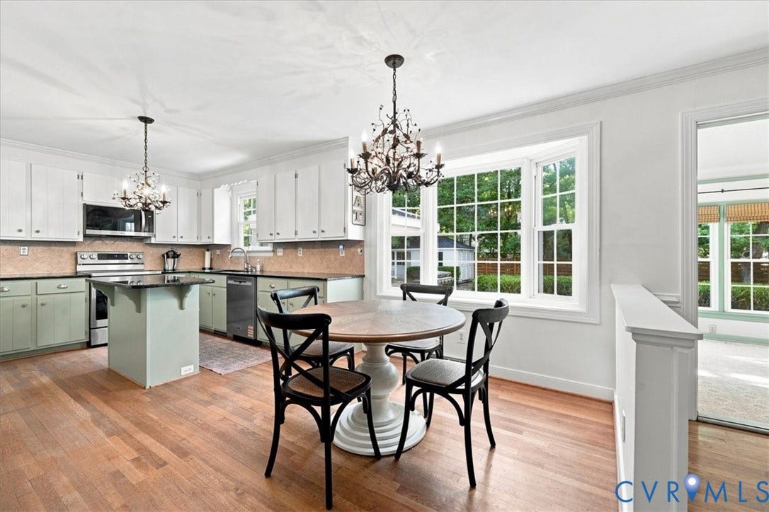 10204 Steuben Drive, Henrico, VA 23060 Open-concept kitchen and dining area featuring wood-finish flooring, recessed lighting, and a bay window