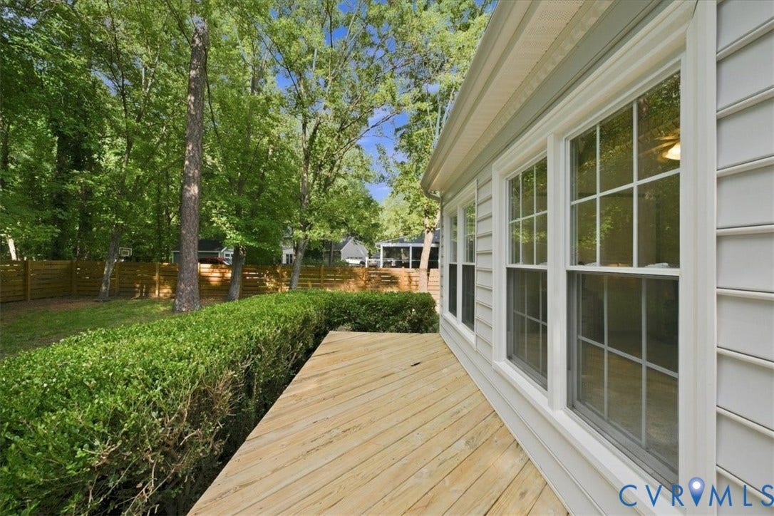 10204 Steuben Drive, Henrico, VA 23060 Exterior siding with white trim around multiple windows and a wooden deck