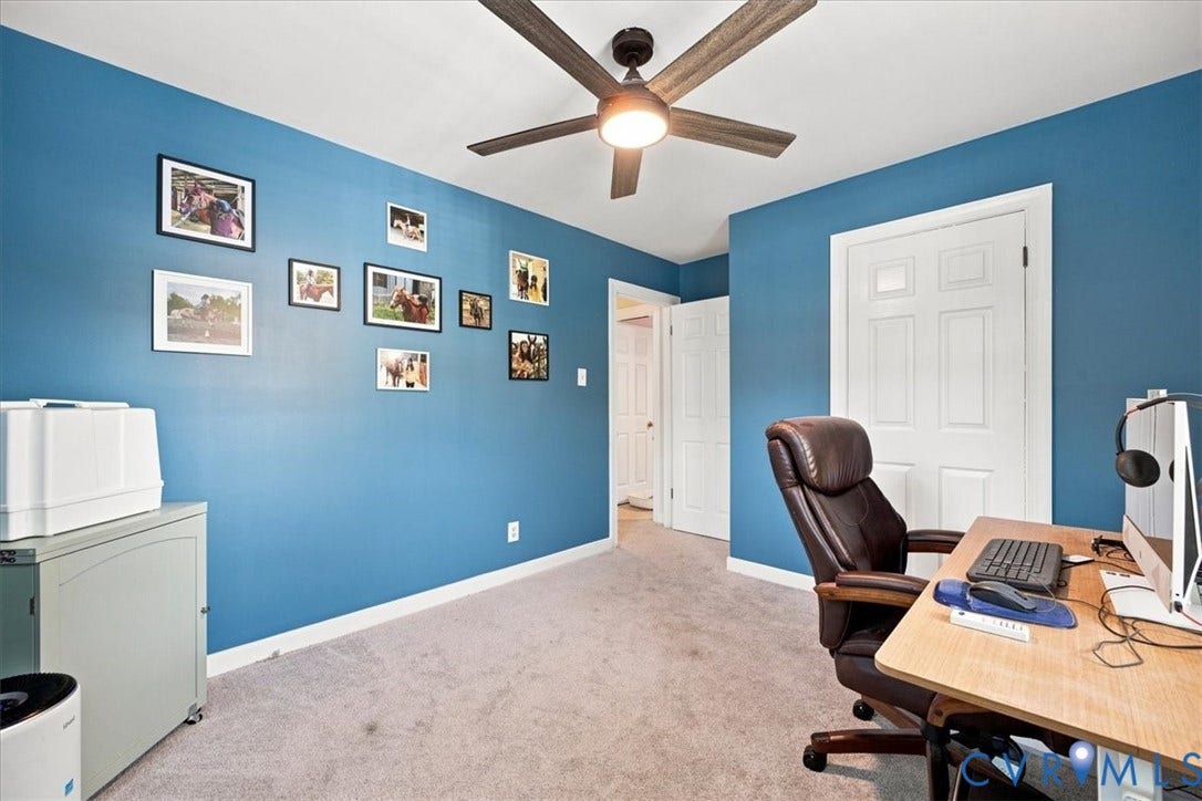 10204 Steuben Drive, Henrico, VA 23060 Carpeted interior room featuring blue walls, white baseboards, and a ceiling fan with integrated lighting