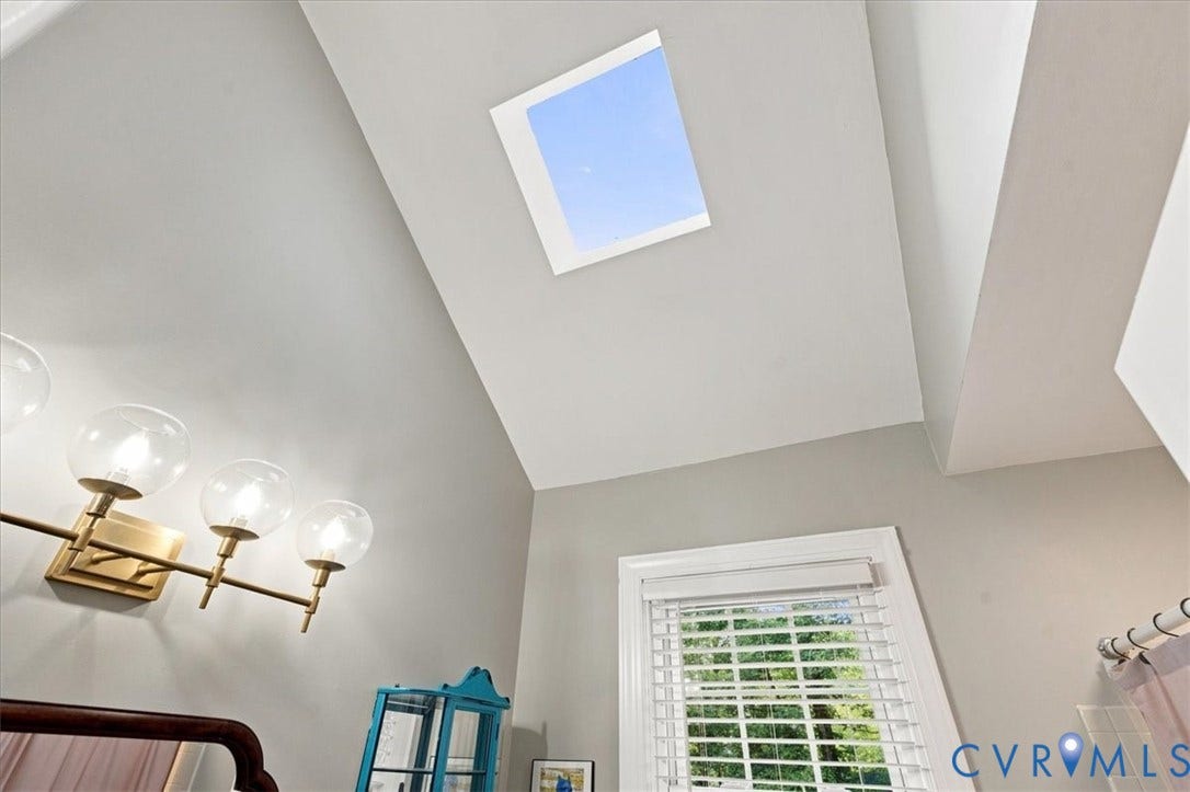10204 Steuben Drive, Henrico, VA 23060 Vaulted ceiling with an integrated skylight, enhancing the interior's natural illumination