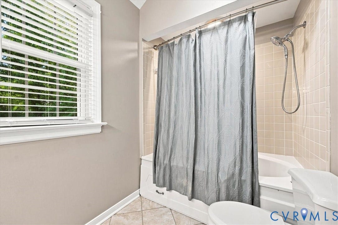 10204 Steuben Drive, Henrico, VA 23060 Bathroom featuring neutral wall paint and a corner tub/shower combination