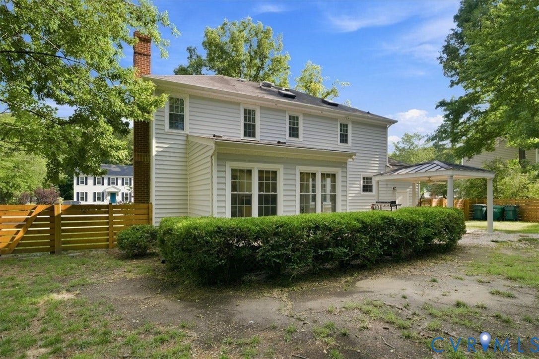 10204 Steuben Drive, Henrico, VA 23060 Two-story home with light-colored siding and a brick chimney