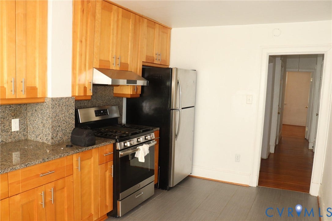 1119 W Grace Street, The Fan District, Richmond, VA 23220 Kitchen featuring wood-finish cabinetry, granite countertops, and stainless steel appliances including a range with an overhead vent