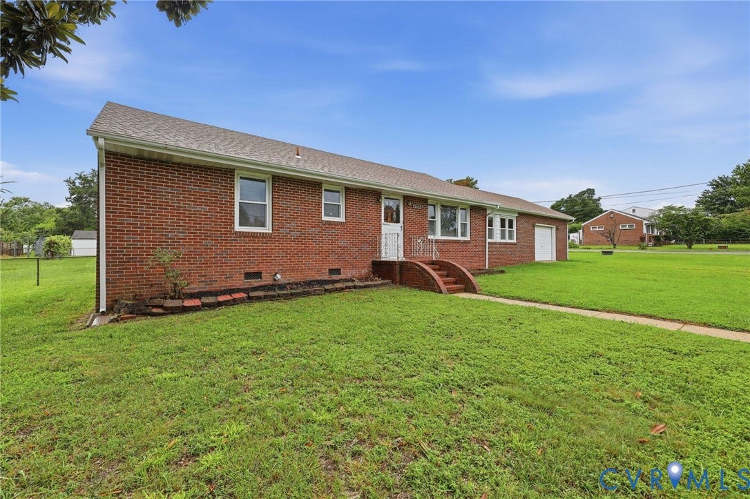 5002 Glendale Avenue, Dinwiddie, VA 23803 Brick exterior with a gabled roof and white window frames