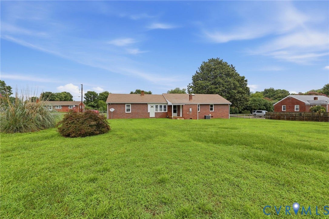 5002 Glendale Avenue, Dinwiddie, VA 23803 Expansive lawn area with mature landscaping and brick exterior