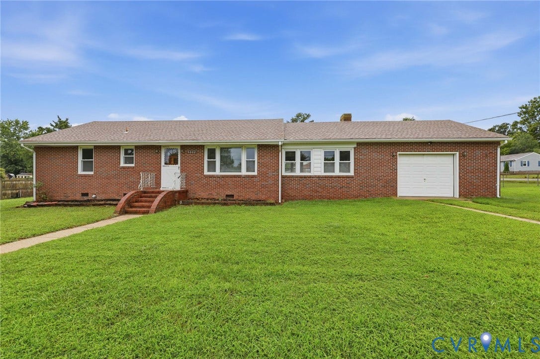 5002 Glendale Avenue, Dinwiddie, VA 23803 Brick exterior with a gabled roof and attached garage