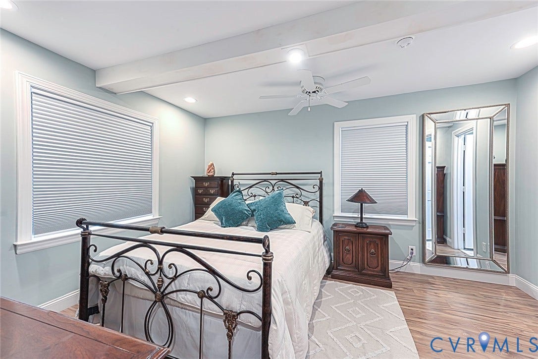 501 Pelham Drive, Richmond, VA 23222 Primary Bedroom featuring wood-finish flooring, two large windows with blinds, and recessed ceiling lighting