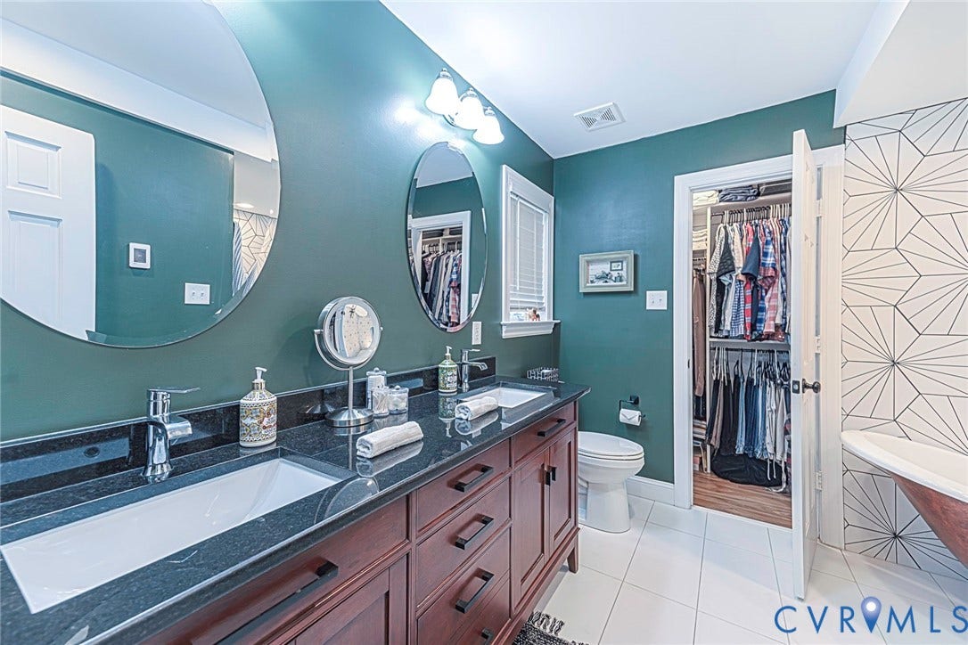 501 Pelham Drive, Richmond, VA 23222 Double vanity with dark wood cabinetry, granite countertop