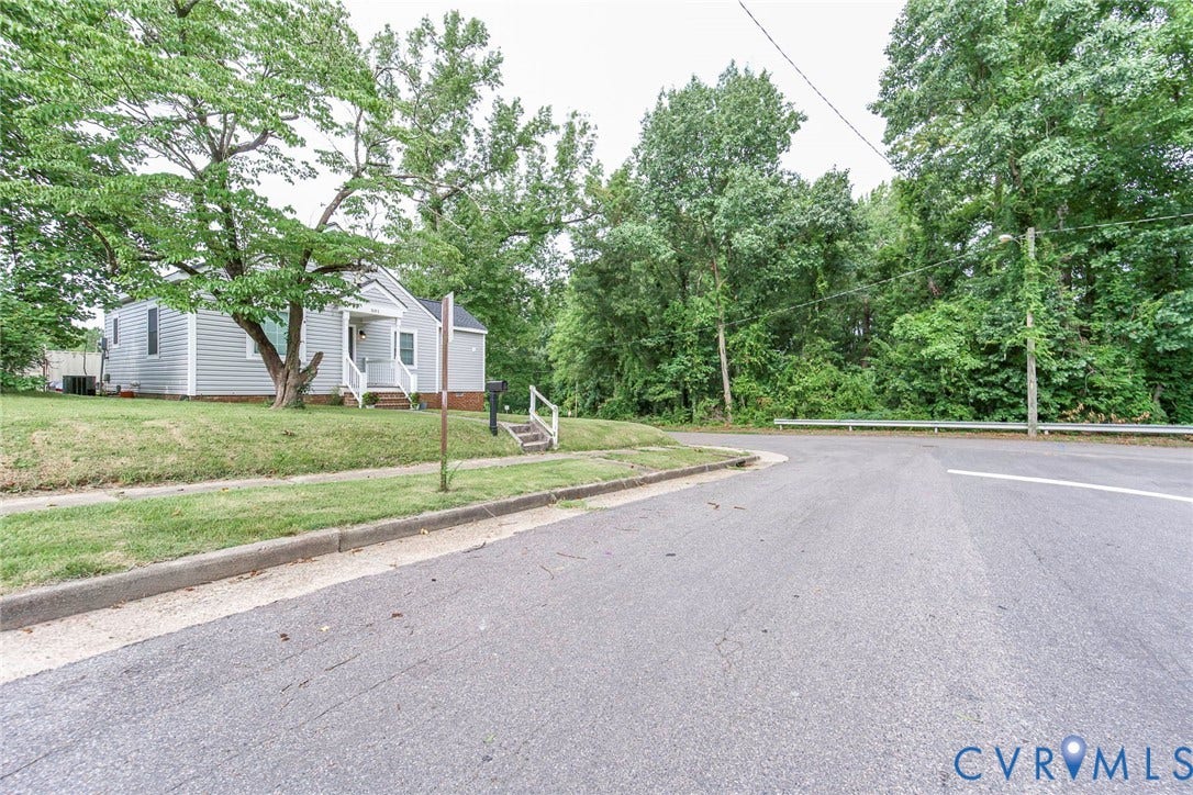 501 Pelham Drive, Richmond, VA 23222 Light gray siding exterior with a covered porch and white railing