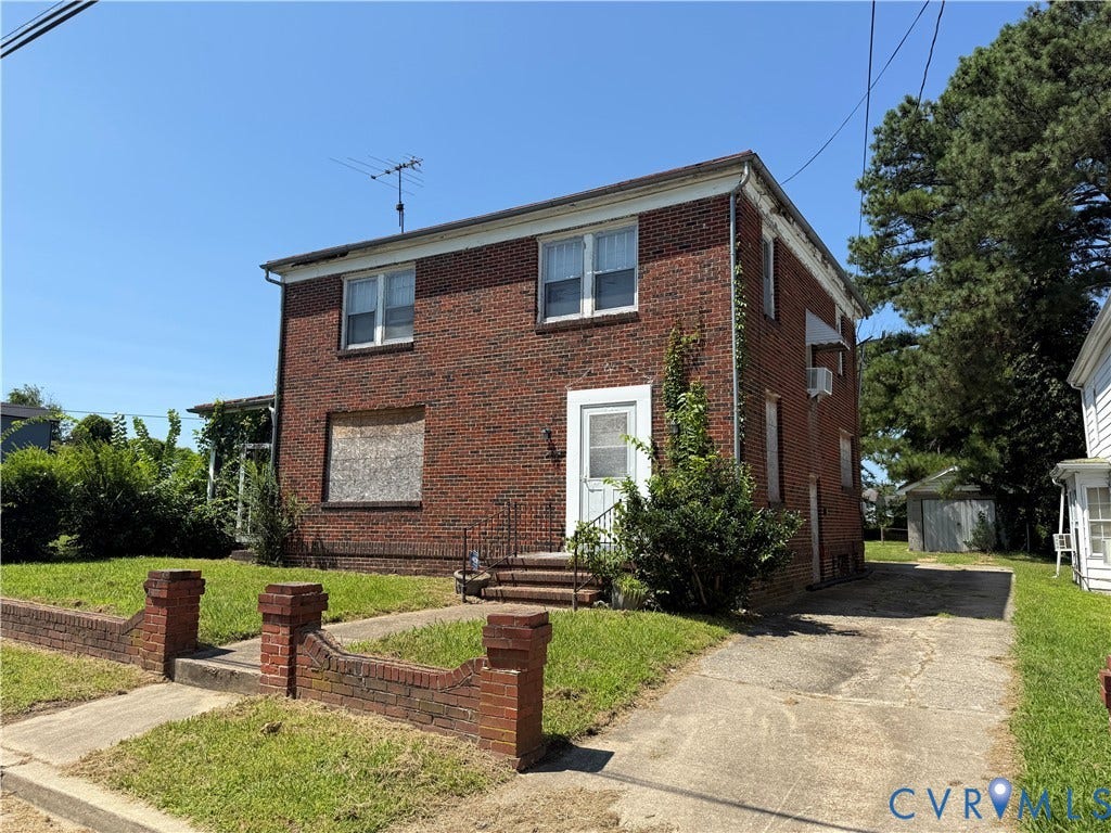 742 S Jones Street, Petersburg, VA 23803 Two-story brick exterior with white trim