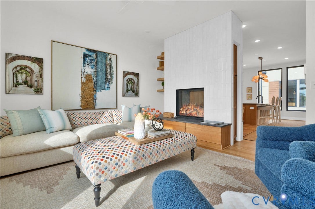 4506 1/2 Grove Avenue, Munford On Grove, Richmond, VA 23221 Living area featuring a modern fireplace with a tiled surround, integrated wood-finish storage, and a light wood-finish flooring