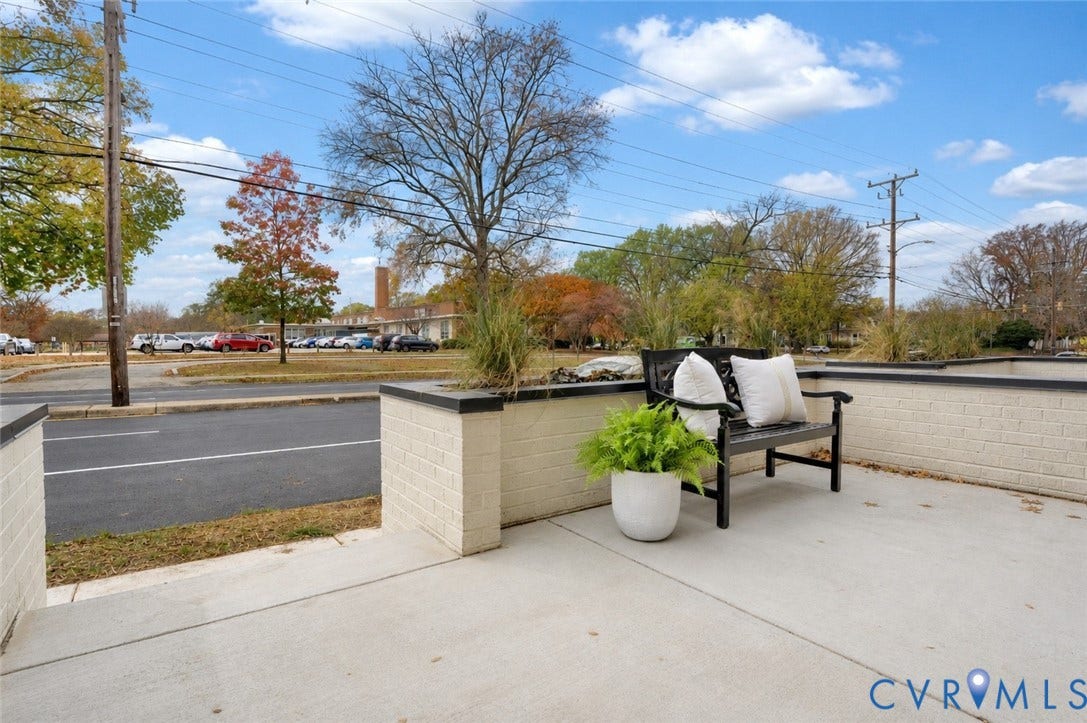 4506 1/2 Grove Avenue, Munford On Grove, Richmond, VA 23221 Patio area featuring light-colored brick retaining walls with dark caps