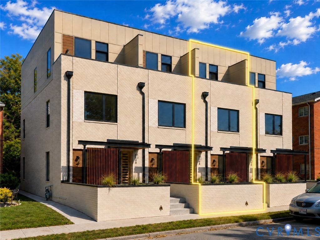4506 1/2 Grove Avenue, Munford On Grove, Richmond, VA 23221 Modern multi-story townhouse exterior featuring a light-toned brick facade and dark-framed windows