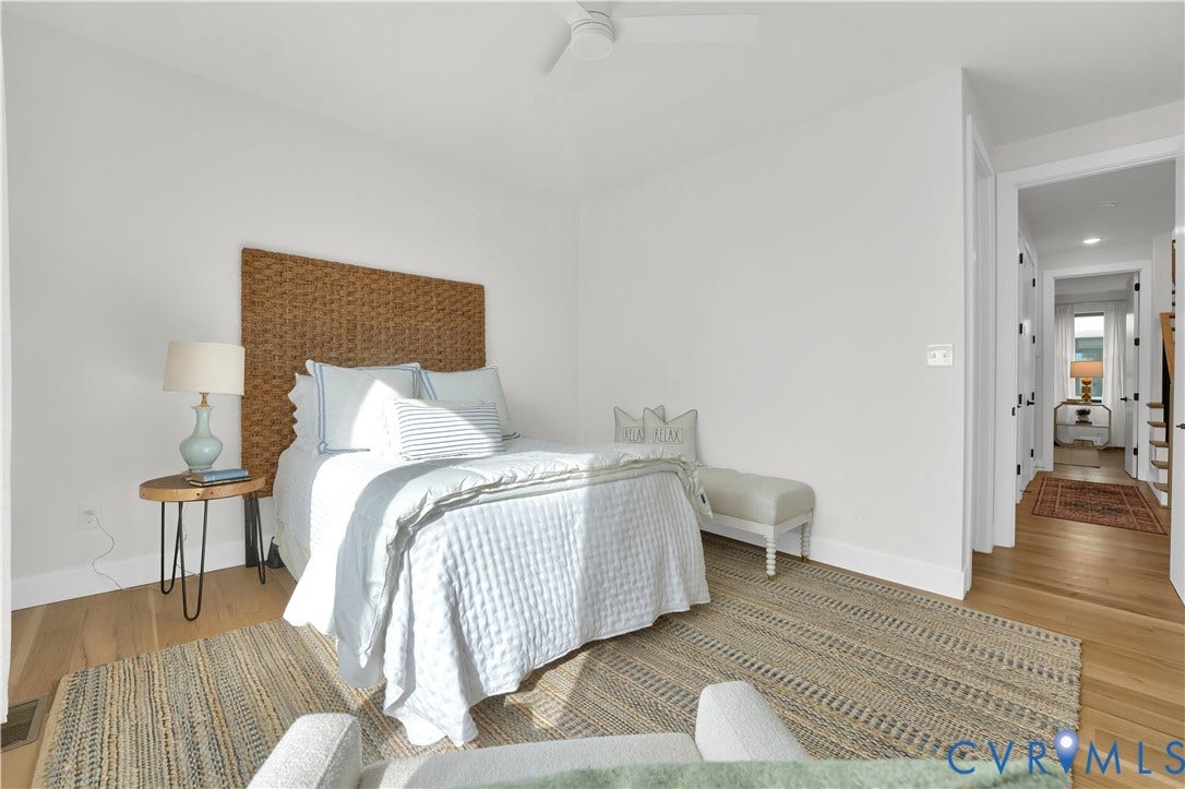 4506 1/2 Grove Avenue, Munford On Grove, Richmond, VA 23221 Bedroom featuring hardwood flooring, white walls, and a ceiling fan