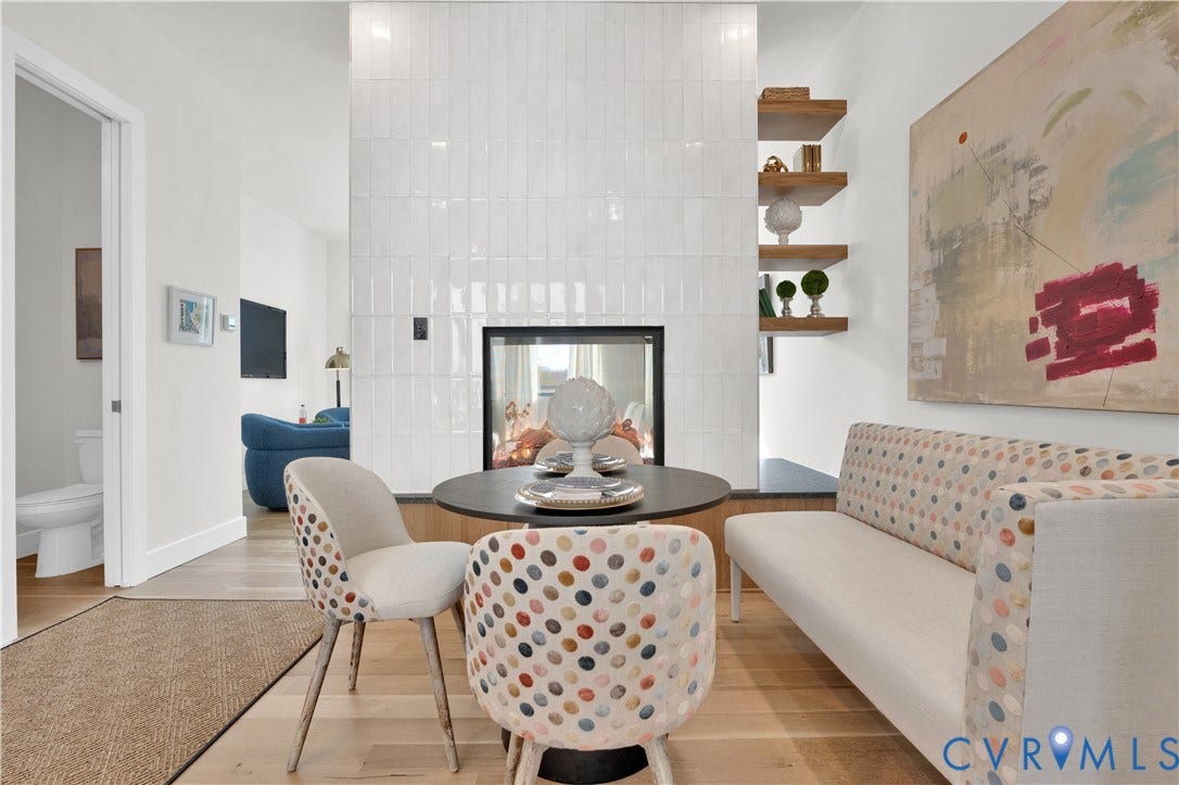 4506 1/2 Grove Avenue, Munford On Grove, Richmond, VA 23221 Modern fireplace with a white vertical tile surround, integrated firebox, and built-in wood shelving