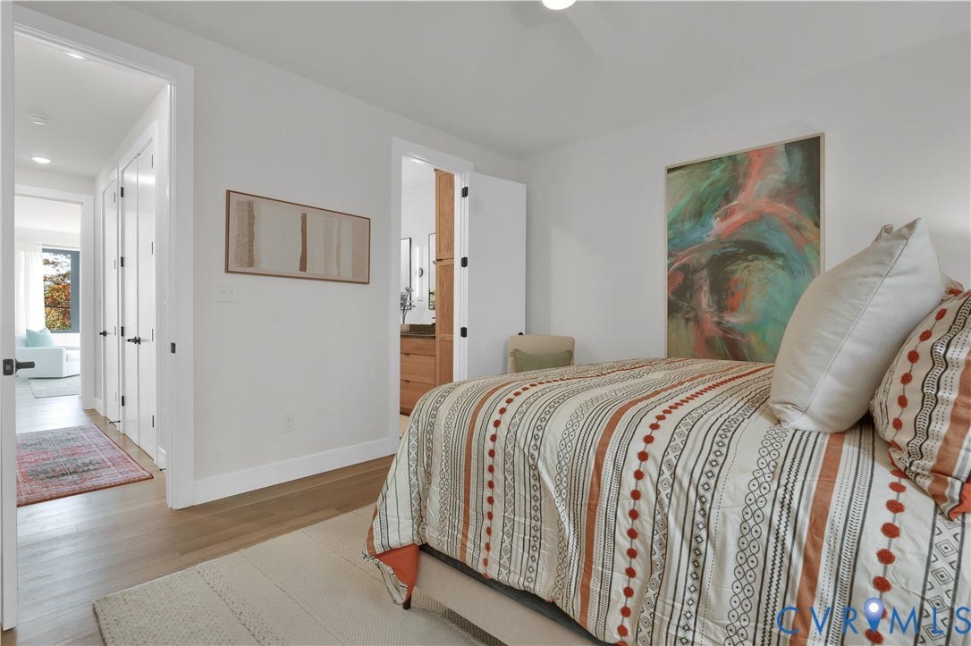 4506 1/2 Grove Avenue, Munford On Grove, Richmond, VA 23221 Bedroom featuring light wood-finish flooring and white walls