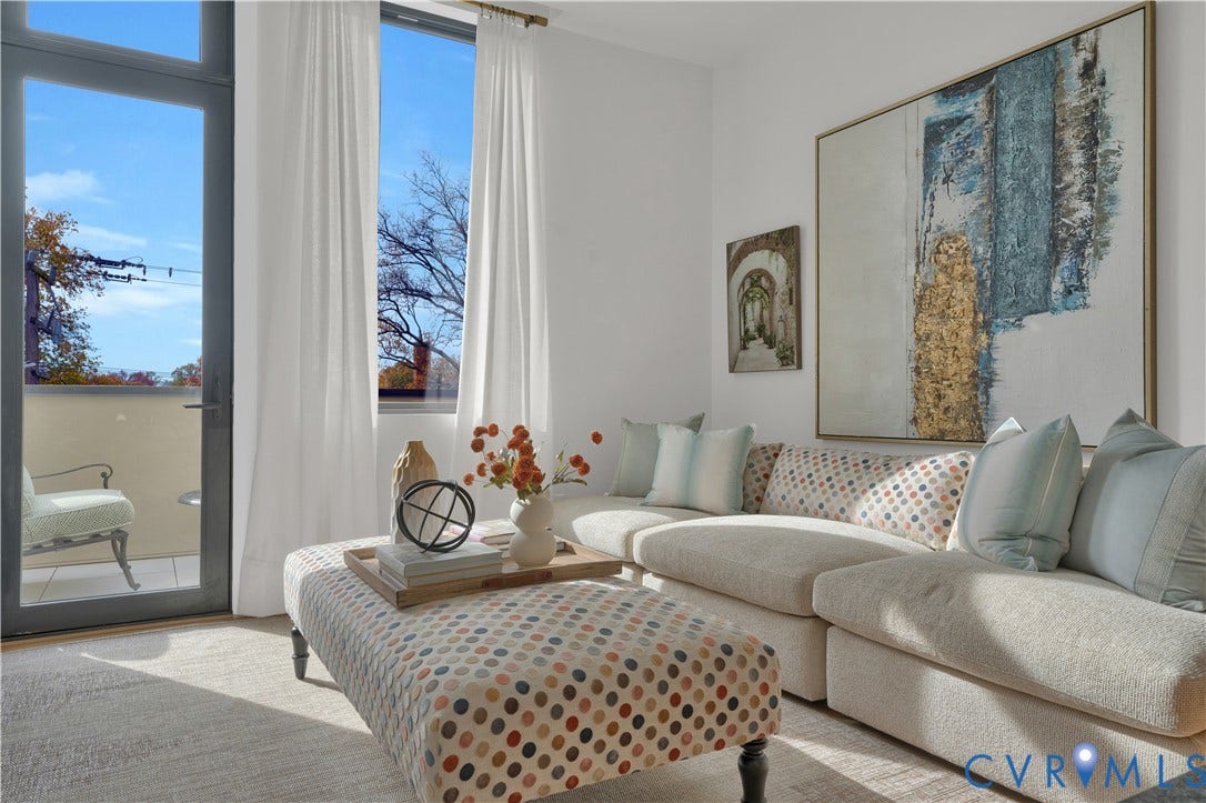 4506 1/2 Grove Avenue, Munford On Grove, Richmond, VA 23221 Living area with a floor-to-ceiling glass door leading to a private balcony
