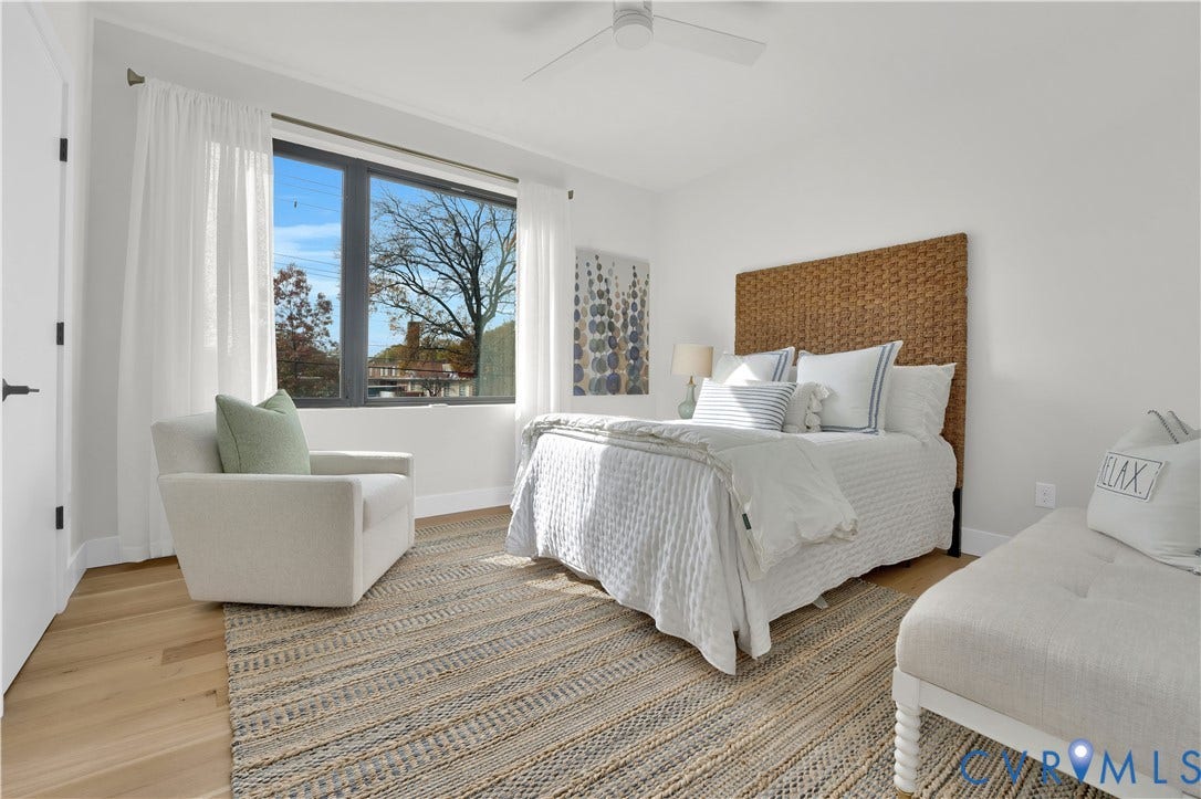 4506 1/2 Grove Avenue, Munford On Grove, Richmond, VA 23221 Bedroom featuring wood-finish flooring, a contemporary ceiling fan, and large windows with sheer panel drapes