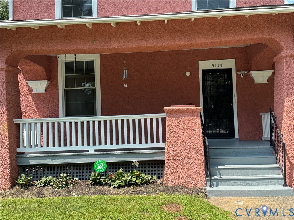 3118 Barton Avenue, Brookland Park, Richmond, VA 23222 Stucco exterior with a covered porch, white balustrade, and a gray-painted concrete staircase with black metal railings