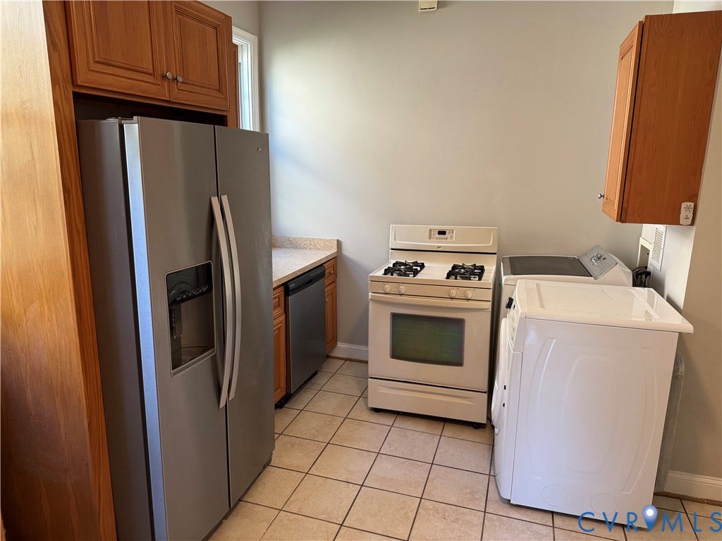 3118 Barton Avenue, Brookland Park, Richmond, VA 23222 Kitchen featuring wood cabinetry, stainless steel refrigerator, white gas range, and square tile flooring
