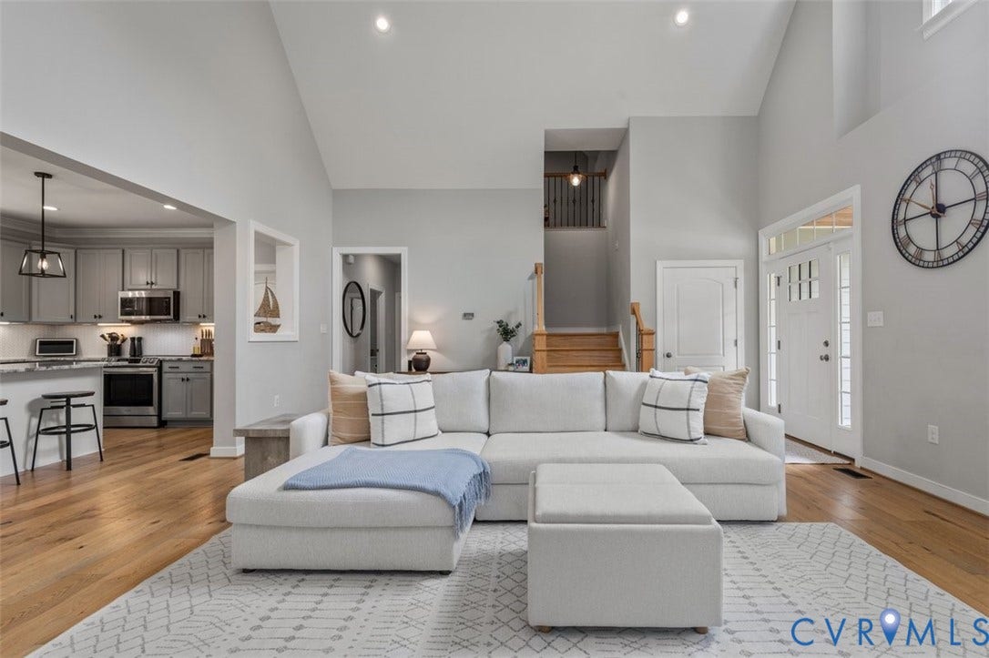 9081 Deerlake Drive, Charming, New Kent, VA 23124 Cathedral ceilings with LVP flooring, recessed lighting, and a gas fireplace