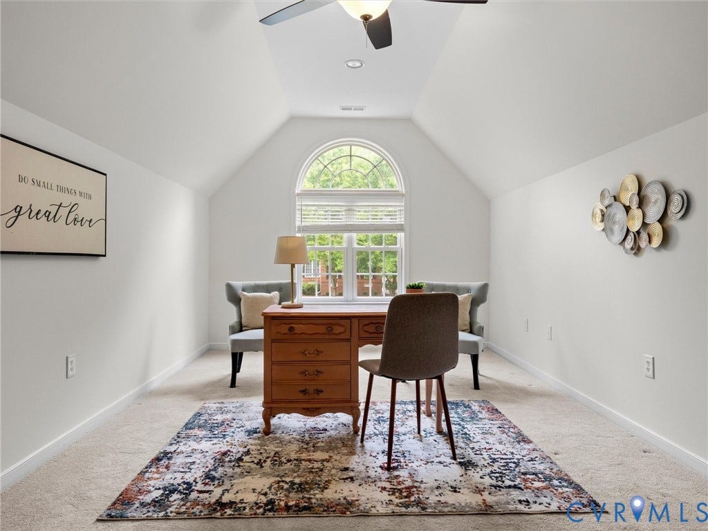 6100 Lilting Branch Way, Moseley, VA 23120 Vaulted ceiling with ceiling fan, arched window with blinds, and light-colored carpeting