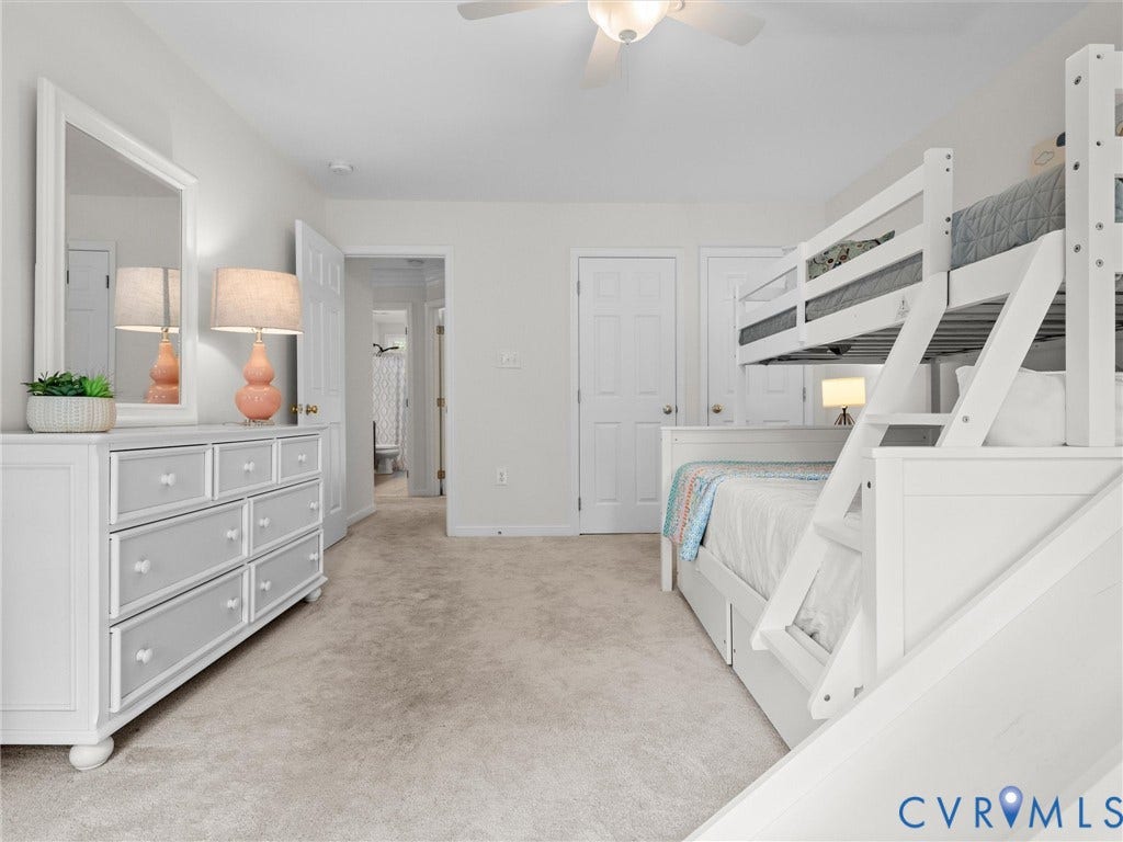 6100 Lilting Branch Way, Moseley, VA 23120 Plush carpet flooring, ceiling fan, and white paneled doors