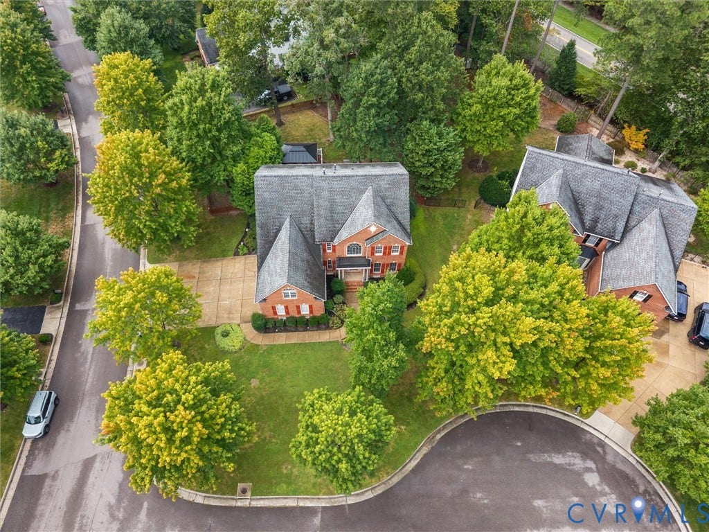 6100 Lilting Branch Way, Moseley, VA 23120 Red brick exterior with multiple gables and a gray shingle roof