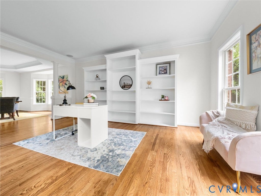 6100 Lilting Branch Way, Moseley, VA 23120 Hardwood flooring throughout, built-in shelving, crown molding, and large windows with natural light