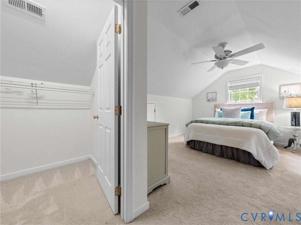 6100 Lilting Branch Way, Moseley, VA 23120 Sloped ceiling bedroom featuring a ceiling fan, window with blinds, and light-toned carpeting
