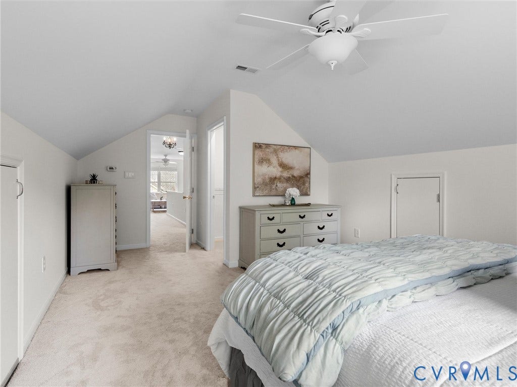 6100 Lilting Branch Way, Moseley, VA 23120 Carpeted flooring, vaulted ceiling, and built-in ceiling fan with lighting