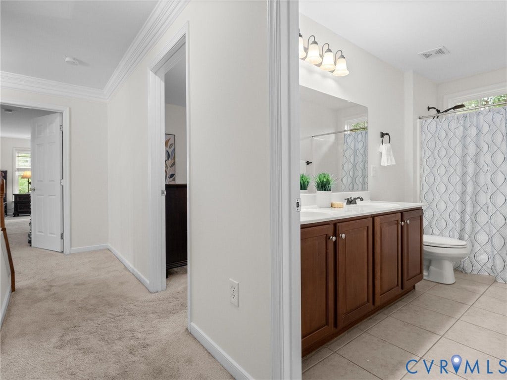 6100 Lilting Branch Way, Moseley, VA 23120 Hallway with carpet flooring and crown molding